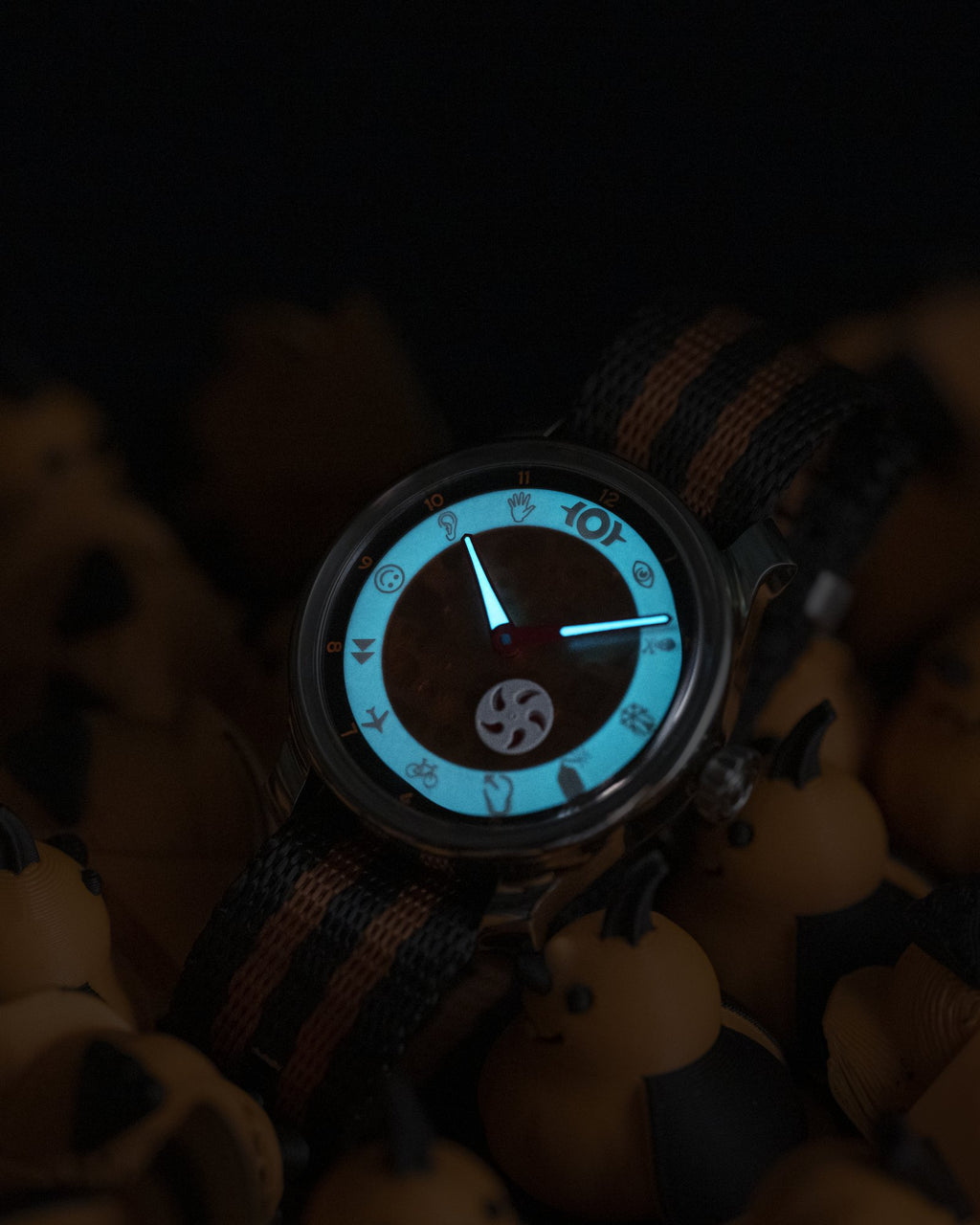 the jack o' lantern's dial glowing blue in the dark
