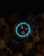 the jack o' lantern's dial glowing blue in the dark